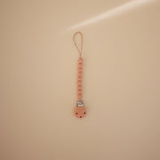 Mushie Silicone Pacifier Clip -Hera Powder Pink